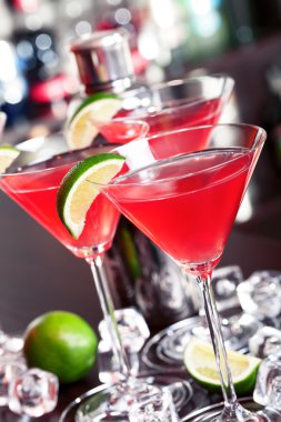 Cosmopolitan cocktail in bar clipart