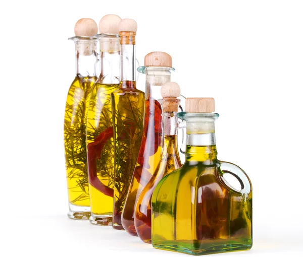 Olive oil in flessen met kruiden — Stockfoto