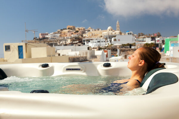 Young woman enjoying outside jacuzzi