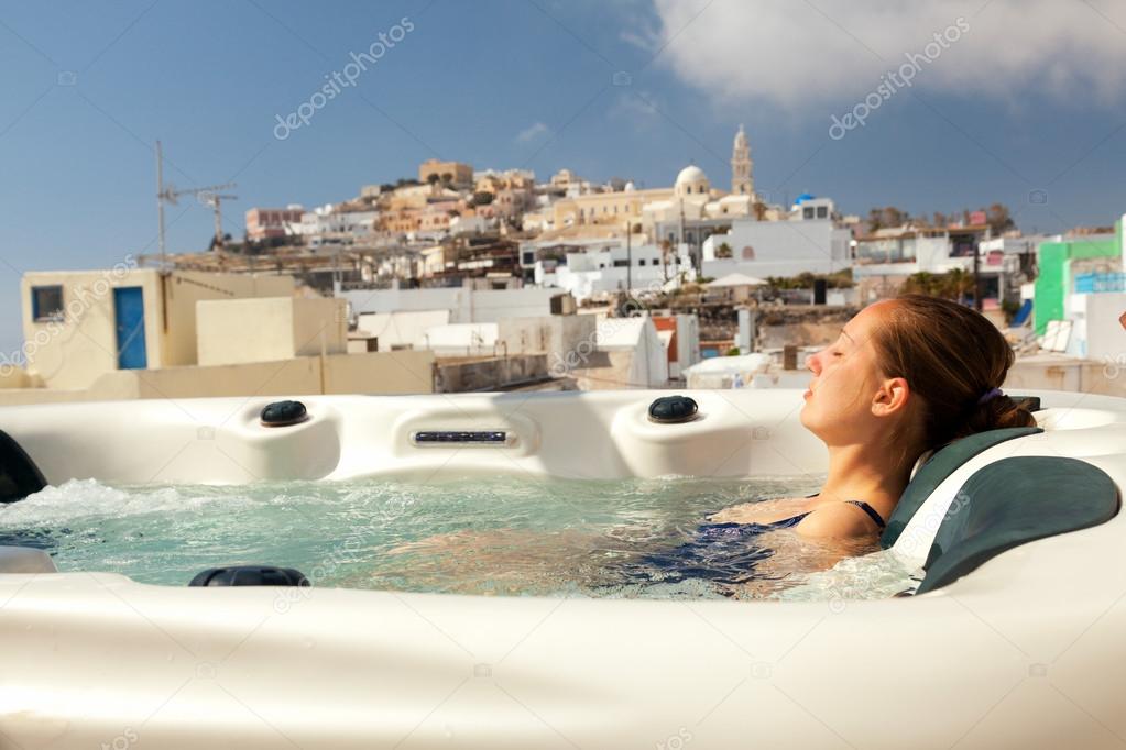 Young woman enjoying outside jacuzzi