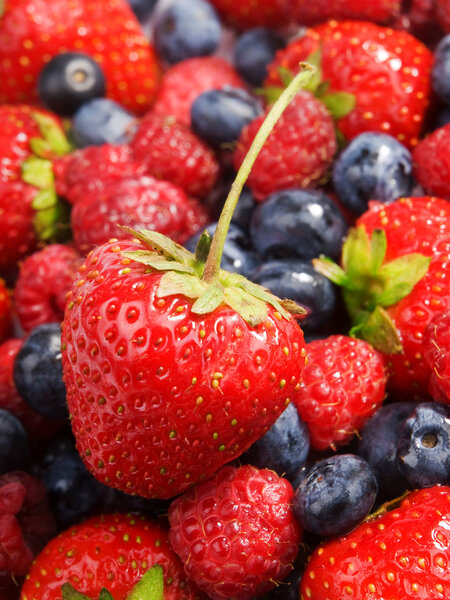 Strawberries and blueberries pile