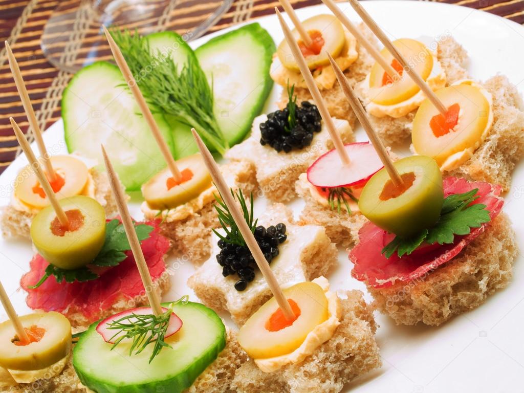 Vegetarian appetizers on wooden sticks — Stock Photo © ivanmateev 62178907