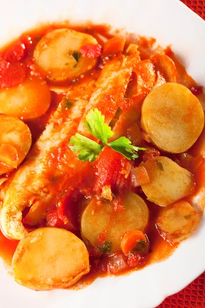 Fish stew in tomato sauce with patatoes — Stock Photo, Image