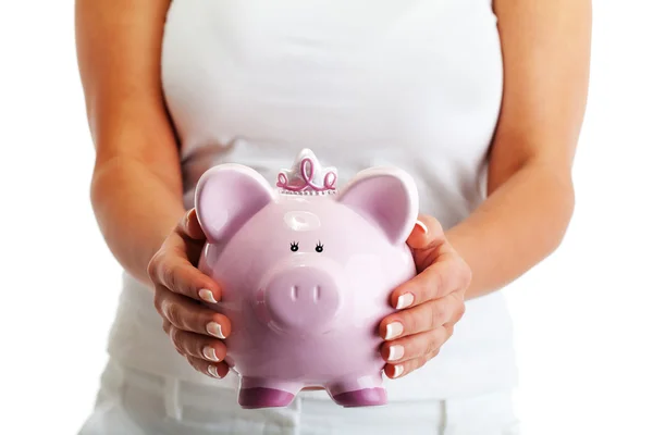 Vrouw met varken geld-box — Stockfoto