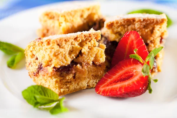 Homemade cake served with strawberries Royalty Free Stock Images