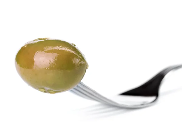 Green olive in fork — Stock Photo, Image