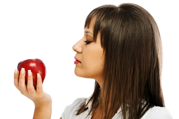 吃红苹果的年轻女人 图库图片
