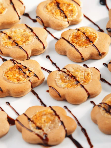 Cookies with chocolate toppling — Stock Photo, Image