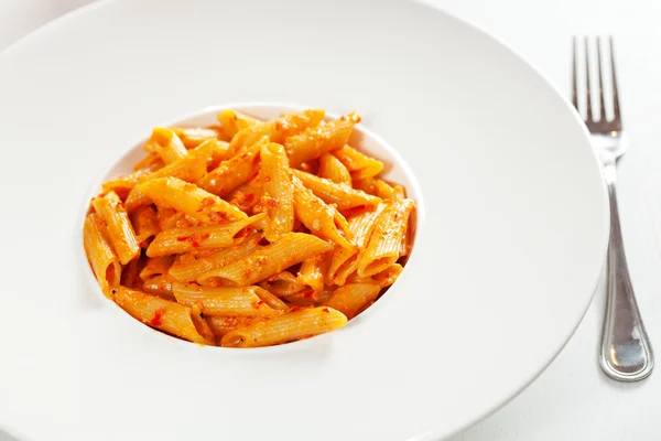 Penne com creme e pimentas — Fotografia de Stock