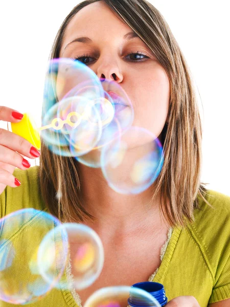 Chica soplando burbujas — Foto de Stock