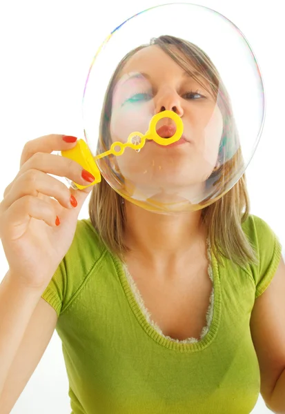 Chica soplando burbujas — Foto de Stock