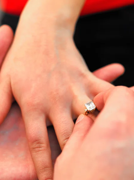Engagement ring on woman's hand Stock Picture