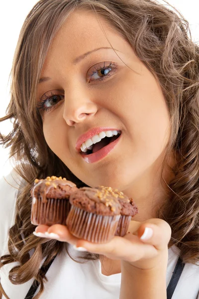 Woman with chocolate muffins Royalty Free Stock Images