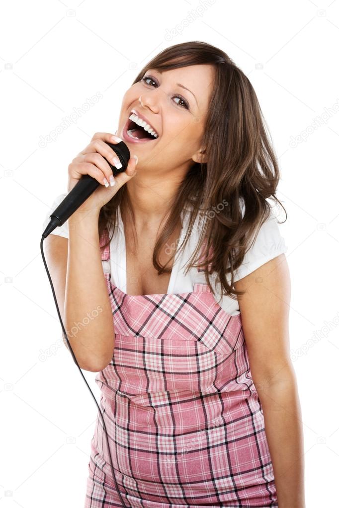 Young woman singing with  microphone