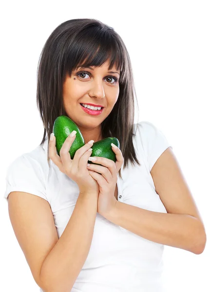 Junge Frau hält Avocado in der Hand — Stockfoto