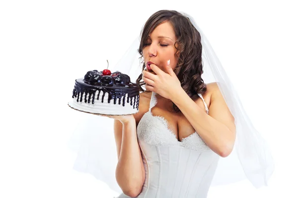 Giovane sposa mangiare torta — Foto Stock