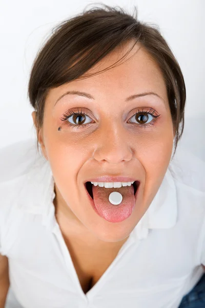 Young woman taking   pill Royalty Free Stock Images