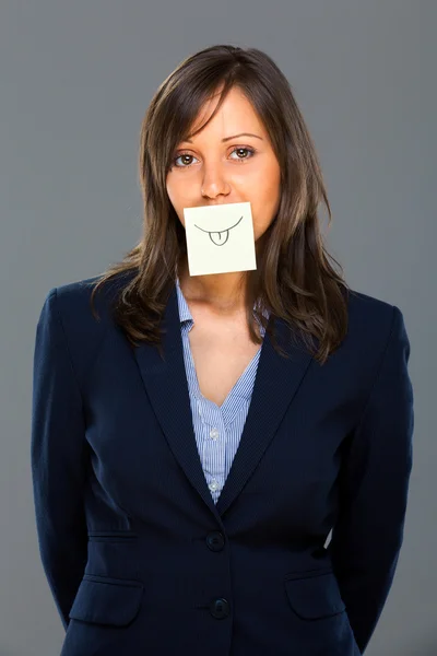 Businesswoman with sticky note — Stock Photo, Image