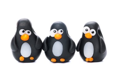 Pinguins made of polymer clay clipart