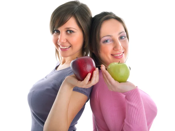 Jonge vrouwen met groene appels — Stockfoto