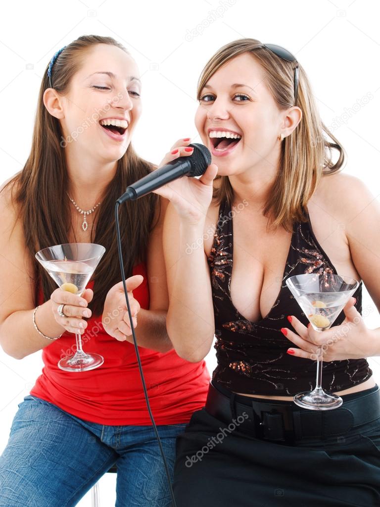 Girls singing with microphone