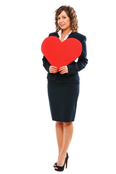 Businesswoman holding red paper heart — Stock Photo, Image