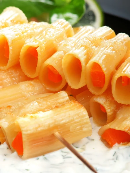 Stuffed macaroni with carrots — Stock Photo, Image