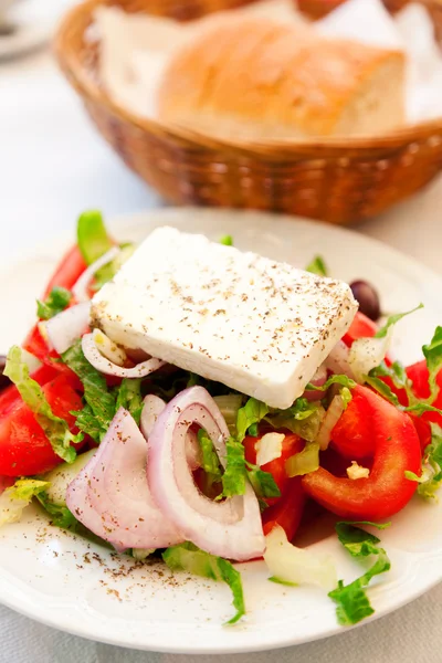 Greek salad in restaurant — Stock Photo, Image