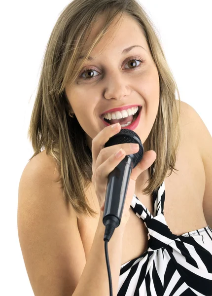 Menina cantando com microfone — Fotografia de Stock