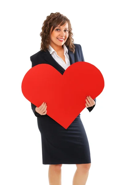 Businesswoman holding red paper heart — Stock Photo, Image