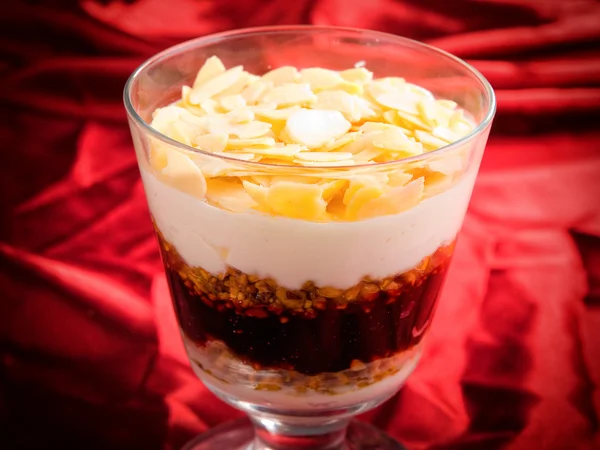 Cream with nuts in glass — Stock Photo, Image