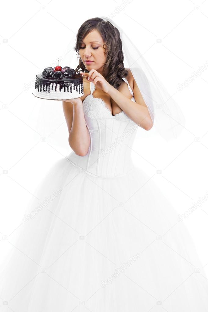 Young bride eating cake