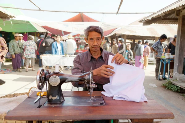 Burmese man sewing clothes — Stock Photo, Image