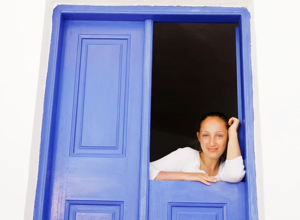 Beautiful woman at old door — Stock Photo, Image