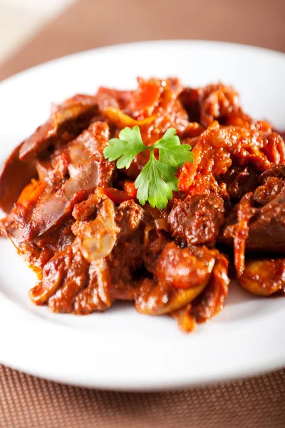 Chicken livers with tomato sauce — Stock Photo, Image