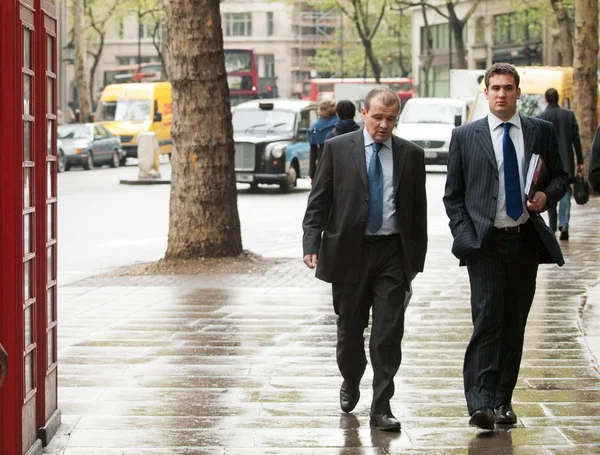 Two Middle aged businessmen in London