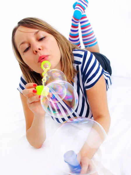 Girl blowing bubbles — Stock Photo, Image