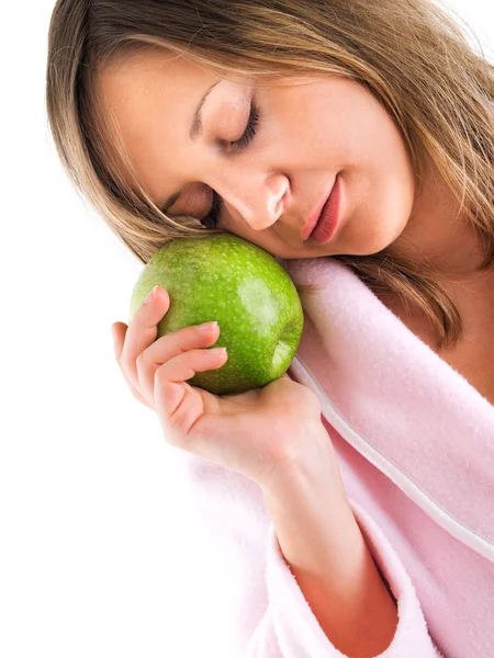 Frau im Hausmantel mit Apfel — Stockfoto