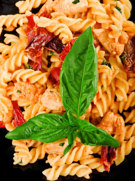 Fusilli with salmon and dried pepper — Stock Photo, Image