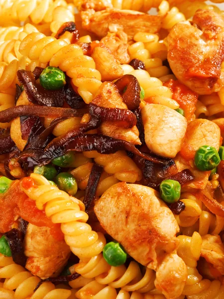 Fusilli with peas and chicken — Stock Photo, Image