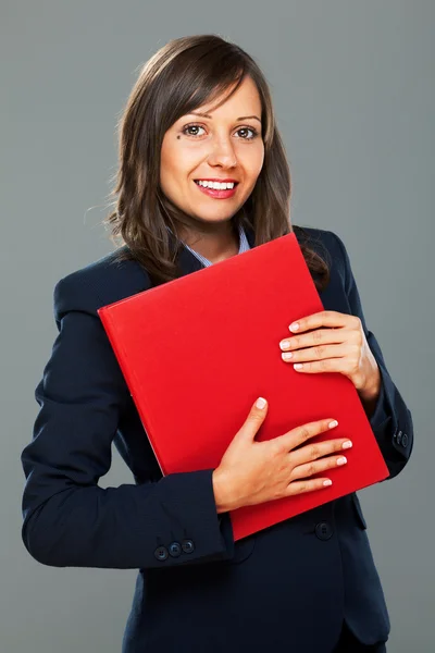 Businesswoman holding folders and smiling — Stock Photo, Image