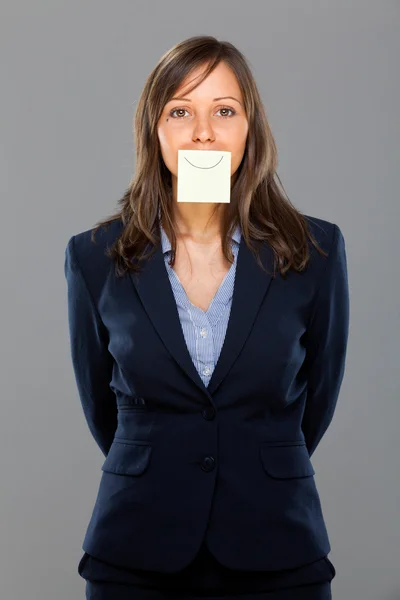 Businesswoman with sticky note — Stock Photo, Image