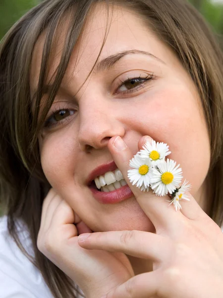 Beautiful woman with camomiles Royalty Free Stock Images