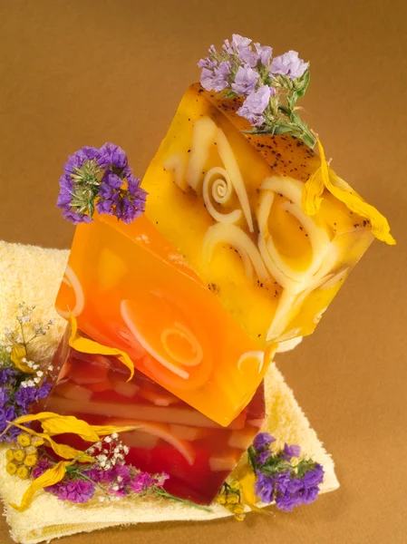 Soaps with Flowers on yellow — Stock Photo, Image