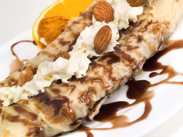 Pancakes with chocolate on white — Stock Photo, Image