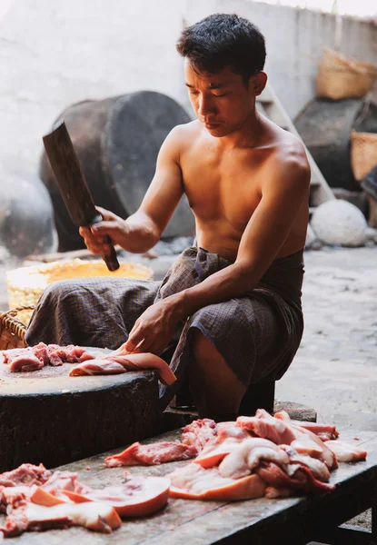 Burmese man cooking meat — Stock Photo, Image