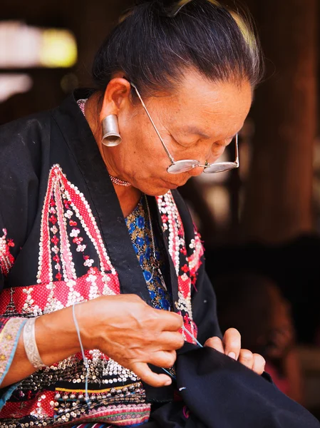 Old Thai woman with large earings