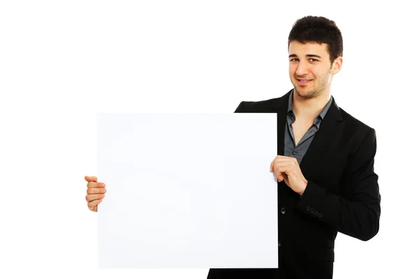 Joven empresario sosteniendo tablero en blanco — Foto de Stock