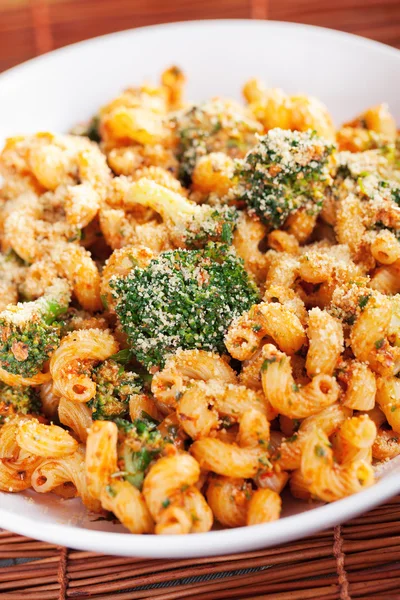 Pasta with broccoli  and tomato sauce — Stock Photo, Image