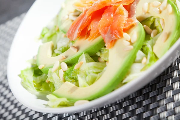 Salmon salad with avocado — Stock Photo, Image